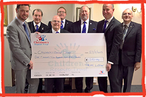 Freemasons from Tyrian Lodge at Eastbourne's Masonic Hall presented a charity donation for £1,250 to the Children's Respite Trust to help children in Sussex