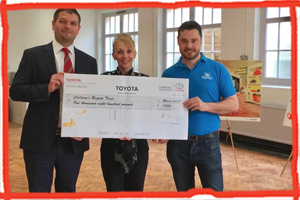 The Children's Respite Trust in East Sussex is given a cheque for £1,800 by Uckfield's SLM Toyota
