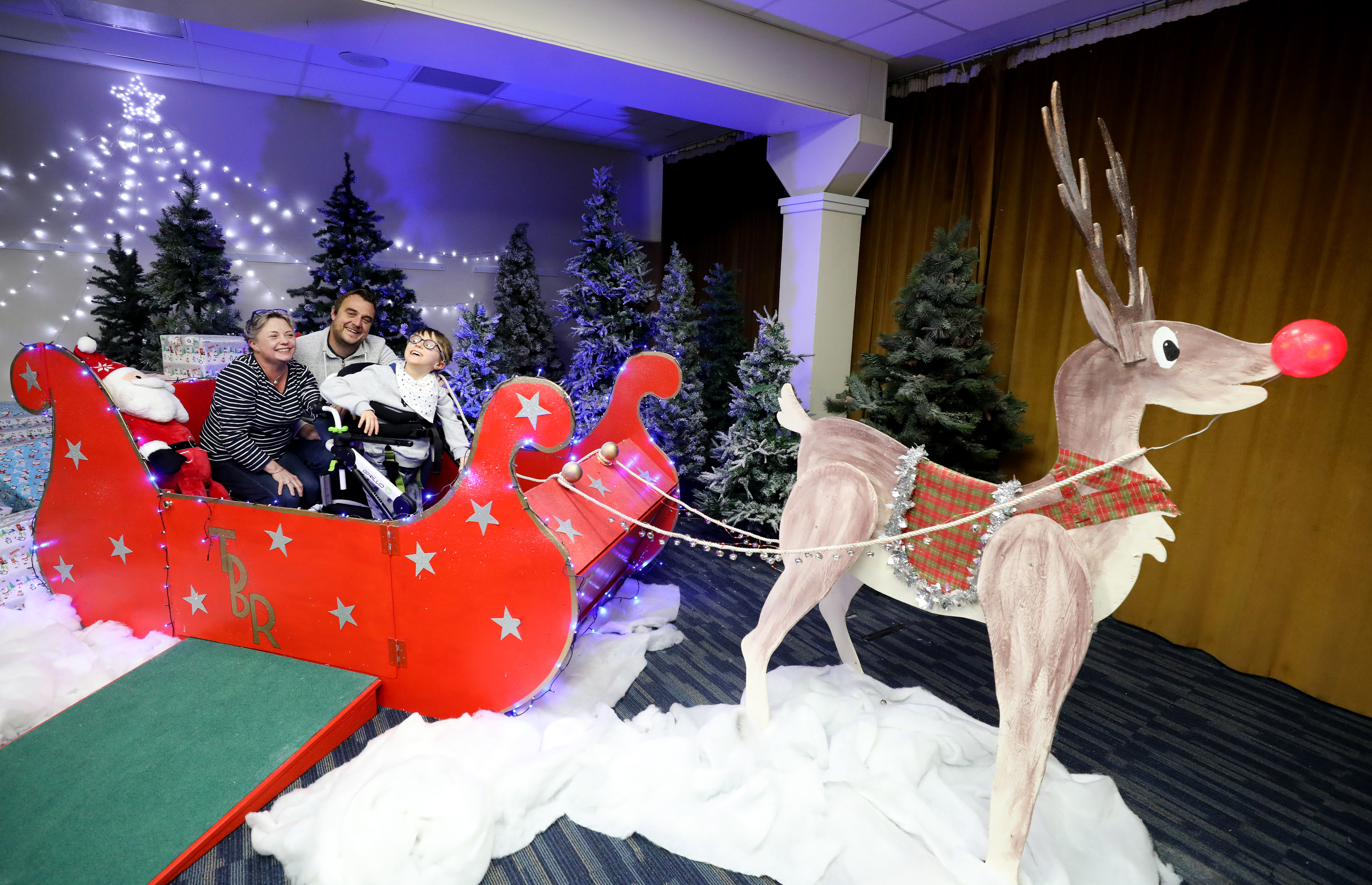 Families pose for photos at the winter wonderland